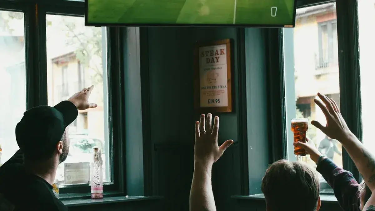 Fans watching football on a screen at The Verulam in St Albans